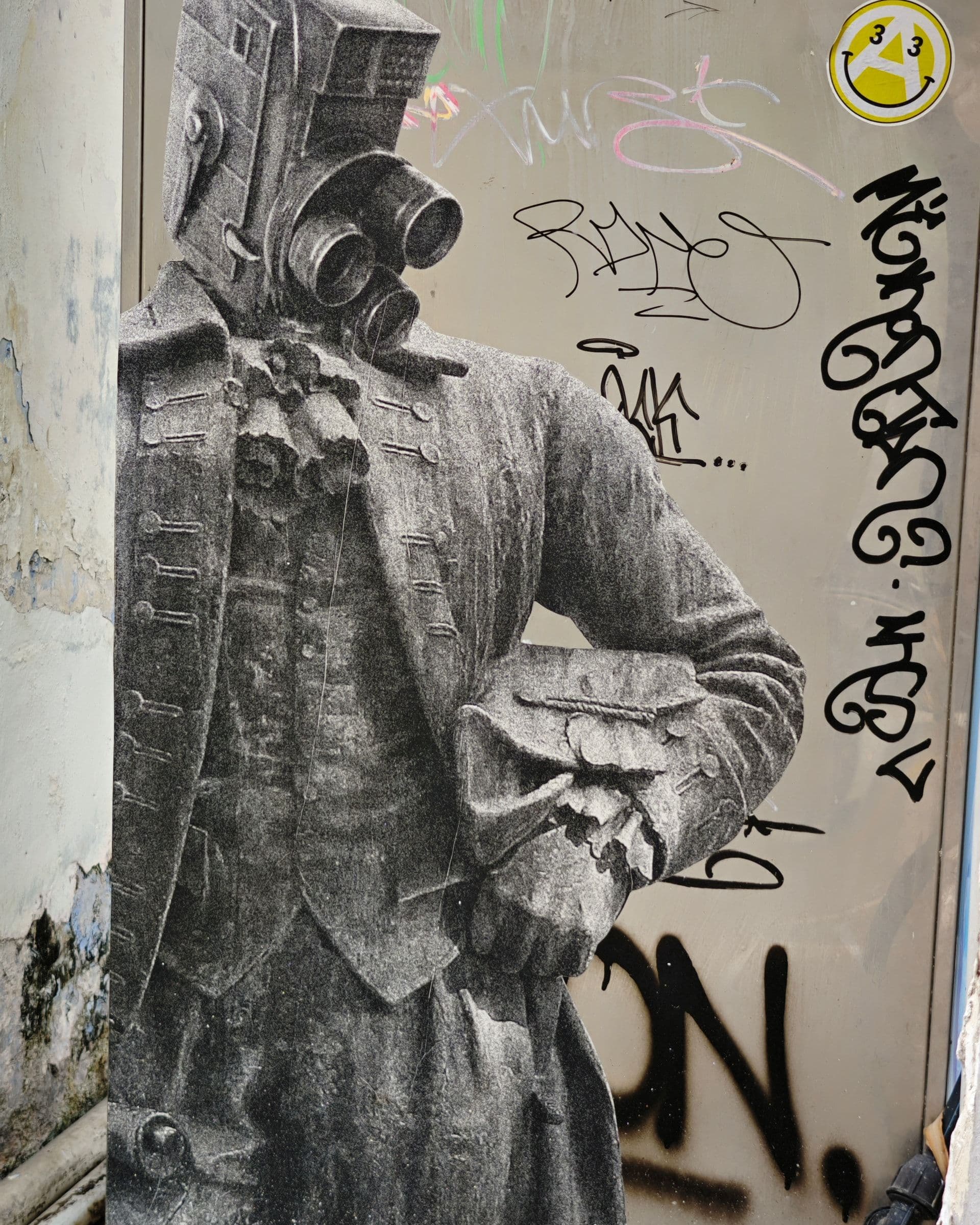 Stencil street art of a figure in colonial dress wearing a gas mask, in the Stewart Lane area of George Town